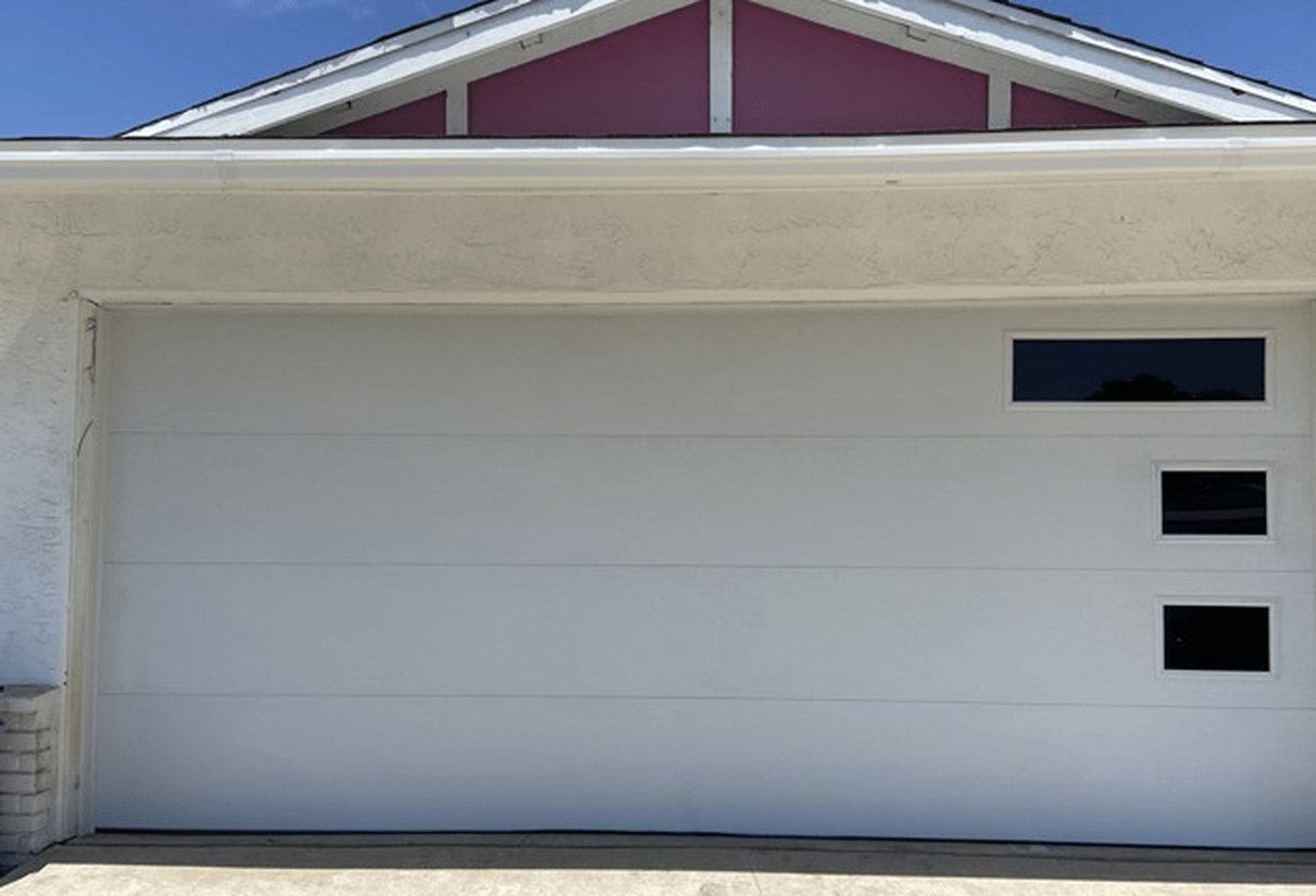 White flush garage door with three side windows